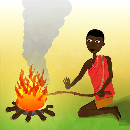 A man putting a long stick into a fire.