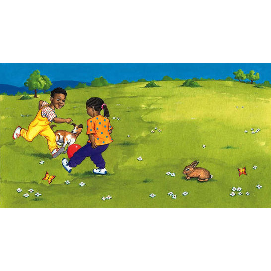 A boy and girl playing football in a field, and a dog joining in.
